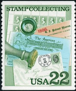 Sheet of Stamps, Handstamp and Magnifying Glass