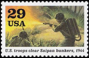 Soldier firing flamethrower (US troops clear Saipan bunkers)